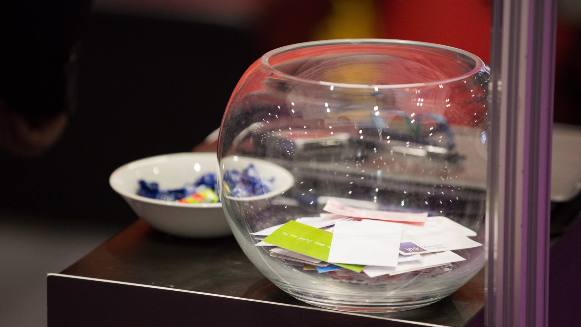 Business cards in a fish bowl.
